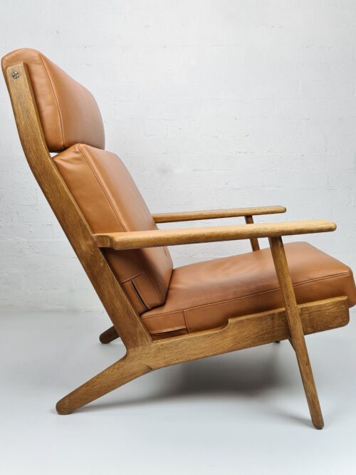 Danish Modern design furniture Mid-century Modern lounge upholstered in cognac-coloured aniline leather. Designed by Hans J Wegner